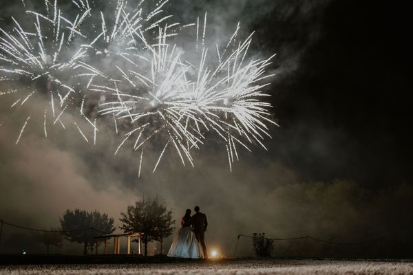 bride and groom watching fireworks at Hampton Court Castle wedding